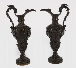 PAIR OF 19TH-CENTURY NEO-CLASSICAL STYLE PATINATED BRONZE EWERS WITH RELIEF DECORATION