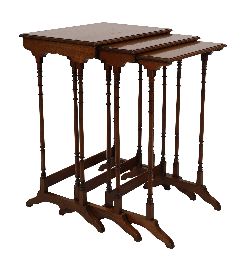 EDWARDIAN MAHOGANY AND CROSSBANDED NEST OF THREE TABLES
