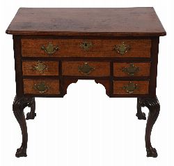 18TH-CENTURY IRISH MAHOGANY LOWBOY ON TREFID FEET