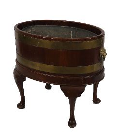 EDWARDIAN OVAL MAHOGANY AND BRASS-BOUND LOG BARREL