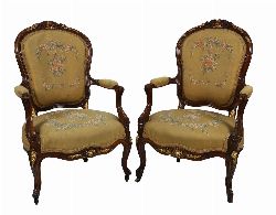 EXCEPTIONAL PAIR OF WALNUT AND PARCEL-GILT ARMCHAIRS