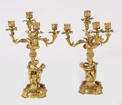 PAIR OF 19TH-CENTURY GILT BRONZE FIVE-LIGHT CANDELABRA WITH PUTTI AND ORNATE SCROLLING
