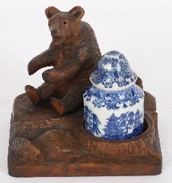 19TH-CENTURY BLACK FOREST BEAR WITH BLUE AND WHITE URN