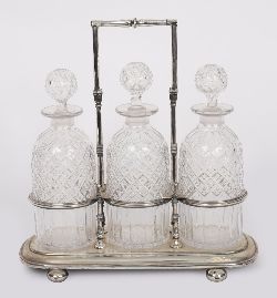 19TH-CENTURY IRISH CUT GLASS DECANTERS IN SILVER PLATED TANTALUS