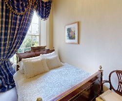 NAPOLEON III MAHOGANY AND BRASS MOUNTED BED