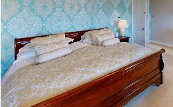 FRENCH EMPIRE STYLE MAHOGANY KING-SIZE SLEIGH BED