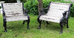 PAIR OF 19TH-CENTURY CAST IRON PATIO ARMCHAIRS WITH LION HEAD DECORATION